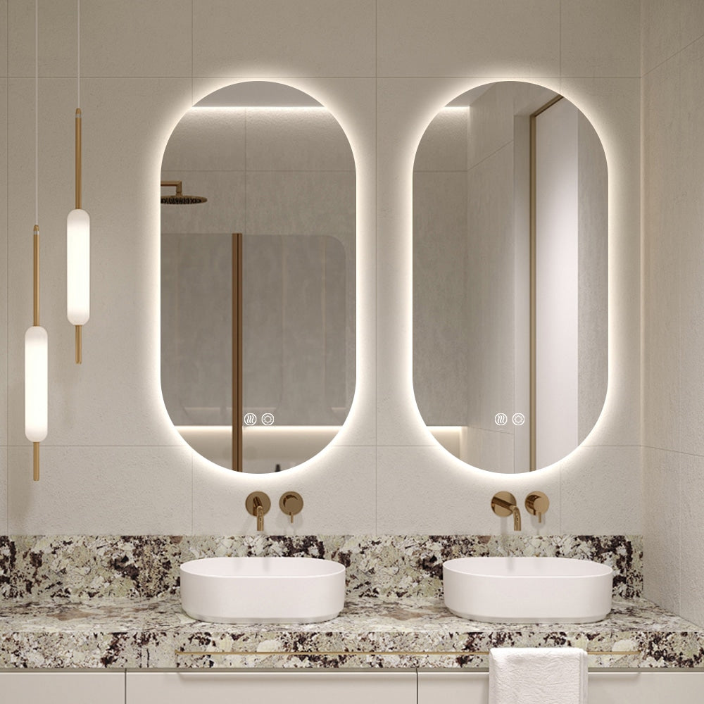 Bathroom interior with a black oval mirror, sink, and shelves with towels and bottles.
